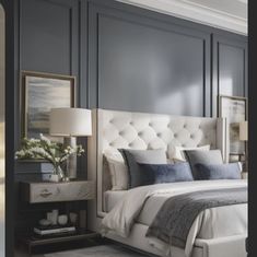 a bedroom with gray walls and white bedding