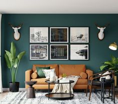 a living room with green walls and pictures on the wall, including deer head heads