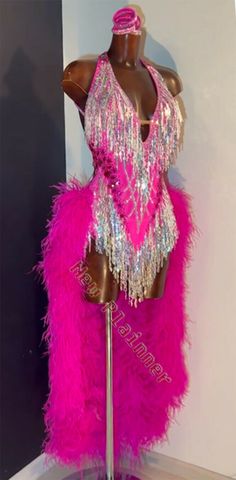 a mannequin dressed in pink and silver