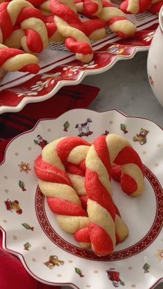 some red and white candy canes on a plate