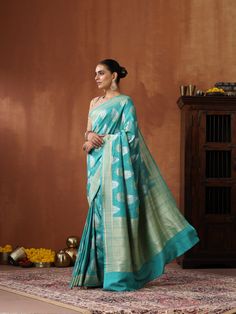 This handloom Banarasi ensemble is a seamless blend of modern elegance and impeccable craftsmanship, tailored to resonate with contemporary preferences. Its allure is undeniable whether adorning the body or displayed flat, showcasing the pure Tussar silk's captivating richness in vibrant hues. Designer Formal Saree For Festive Occasions, Elegant Tussar Silk Sets With Pallu, Elegant Designer Handloom Sets, Luxury Zari Work Saree, Elegant Handloom Cotton Silk Sets, Formal Chanderi Sets With Zari Weaving, Designer Art Silk Traditional Wear, Slub Silk Saree With Woven Motifs For Wedding, Formal Banarasi Silk Sets With Zari Weaving