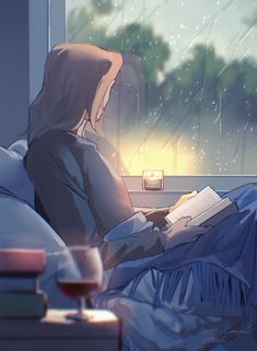 a woman sitting on a bed reading a book in the rain with a glass of wine next to her