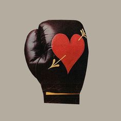 a black boxing glove with a red heart on it