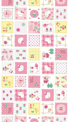 a pink and yellow patchwork quilt with hello kitty on it