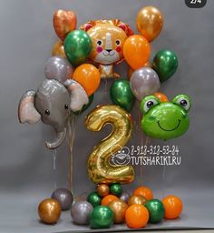 the number two is surrounded by balloons and animals