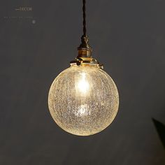 Introducing the Pauline Modern Industrial Sphere Ceiling Light, a perfect blend of contemporary design and industrial charm. This single clear glass hanging pendant light will add a touch of elegance to your living room. Crafted with meticulous attention to detail, it features a beautiful spherical shape that exudes sophistication. The transparent glass shade allows for a radiant glow, creating a warm and inviting ambiance. Its versatile design ensures compatibility with various interior styles, making it an ideal choice for modern and minimalist spaces. Whether used as a focal point or in clusters, the Pauline Ceiling Light is sure to enhance the aesthetic appeal of your home. Illuminate your living space with this stunning piece and let it be the talk of your guests.Size: 5 to 9 Inch Fix Clear Glass Pendant Light, Pendant Light Styles, Hanging Pendant Light, Luminous Colours, Hanging Pendant, Glass Frames, Mode Design, Hanging Pendant Lights, Glass Pendant Light