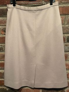 "This Vintage 1970's Beige Mid Length Skirt is in good vintage condition. The only issues with this skirt are there are a few tiny snags in the fabric and the elastic at the waist is slightly worn. Otherwise it's an adorable midi skirt. It has an 8.5 inch vent in the back and a red, white, and blue Union tag. The designer tag says \"Dalton\". Size 14  Lay Flat Measurements:  Length - 27 inches  Waist - 18 inches  Hips - 20 inches" Vintage Beige Mini Skirt, Vintage Style Lined Beige Skirt, Vintage Beige Lined Skirt, Vintage Pencil Skirt With Lining, Workwear Lined Skirt, Vintage Lined Pencil Skirt, Mid Length Skirt, Mid Length Skirts, Vintage 1970s