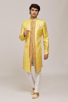 Yellow overlay panel sherwani with woven floral patterns and brown attached inner panel. Comes with churidar.
Components: 2
Pattern: Woven
Type Of Work: Floral
Neckline: Mandarin Collar
Sleeve Type: Full
Fabric: Sherwani: Zari Jacquard, Churidar: Silk Dupion
Color: Yellow,Brown
Other Details: 
Potli buttons
Closure:
Sherwani: Front button
Churidar: Drawstring
Note: Pocket square worn by the model is not for sale
Occasion: Sangeet,Mehendi and Puja - Aza Fashions Yellow Overlay, Churidar, Jacquard Weave, Yellow And Brown, Floral Patterns, Mandarin Collar, Pocket Square, Aza Fashion, Sleeve Type