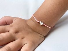 The First Day of School is a big, scary step for some little ones. Make the first day a little less hard with these adorable Mommy and Me heart bracelets. Perfect for the first day of preschool, kindergarten, first grade, daycare, or camp. You will receive two bracelets - a larger size for mom (or dad) and a smaller size for your little one. Bracelets are easily adjustable to fit any wrist size. Bracelets are made out of nylon satin silk cord and a silver metal heart. Bracelet card can be person Handmade Heart-shaped Friendship Bracelets For Birthday, Adjustable Pink Bracelets For Playtime, Adjustable Pink Bracelet For Playtime, Cute Adjustable Charm Bracelet With Heart Charm, Pink Adjustable Bracelet For Playtime, Cute Silver Friendship Bracelets As Gift, Adjustable Birthday Bracelet With Heart Charm, Adjustable Playful Heart Bracelet As Gift, Playful Friendship Bracelets With Heart Beads For Gift