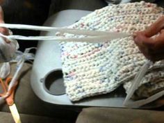 someone is using scissors to cut fabric on a piece of cloth that has been crocheted