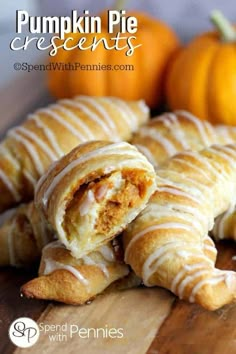 pumpkin pie crescents on a cutting board with oranges in the background and text overlay