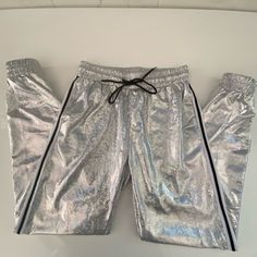 La Society Jogger Pants. Size Large Holograph Drawstring Joggers Silver Two Pocket On The Side With The Black And White Straps On The Side Inseam 28.5 Inches. Waist 15 Inches Gymshark Joggers, Lululemon Dance Studio Jogger, Camo Jogger Pants, White Tracksuit, Snap Pants, Floral Joggers, Cropped Cargo Pants, Cropped Joggers, Drawstring Jogger