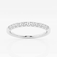 a white gold ring with five diamonds on the side, set in 18k white gold