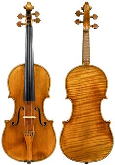 an old violin that is sitting next to another instrument on a white background with the strings still attached