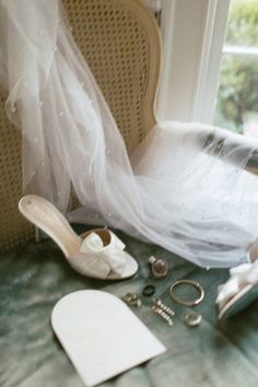 the bride's shoes and accessories are on the floor