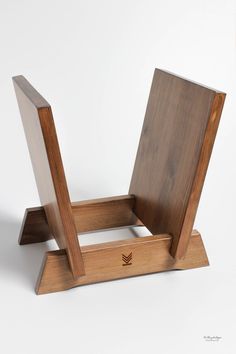 a wooden chair sitting on top of a white table