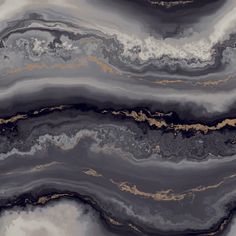 an abstract marble background with gold and black paint on the top, along with white clouds in the sky