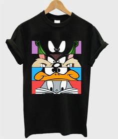 a black t - shirt with an image of donald duck and friends on the front