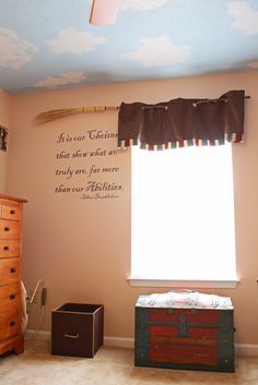 a bedroom with a chest and window in it