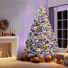 a brightly lit christmas tree in a living room