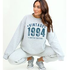 Celebrate in vintage style with this 1994 birthday sweatshirt! Perfect as a 30th birthday gift for her or anyone born in 1994, this 30th birthday shirt is a unique and thoughtful present. The distressed design gives it a trendy and fashionable look, while the soft fabric ensures comfort all day long. Whether you're looking for a 30 year old gift or a standout piece for your own wardrobe, this vintage 1994 birthday sweatshirt is sure to impress. Embrace your personal milestone and show off your t Birthday Sweatshirt With Graphic Print In Relaxed Fit, Birthday Letter Print Relaxed Fit Sweatshirt, Relaxed Fit Letter Print Sweatshirt For Birthday, Casual Birthday Sweatshirt With Lettering, Casual Sweatshirt With Lettering For Birthday, Casual Graphic Print Sweatshirt For Birthday, 1984 Birthday, 1964 Birthday, 1974 Birthday