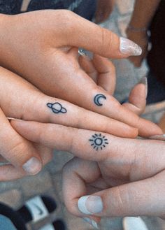 A sun moon and planet finger tattoo Small Matching Tattoos For Friend Group, Cousin Trio Tattoos, Friendship Tattoo Ideas For 3, Tattoo Ideas 3 People, Cute Mini Matching Tattoos, Tattoo Ideas For A Trio, Tattoo Ideas Female 3 Friends, Small Matching Tattoos For 3 People, Trio Finger Tattoos