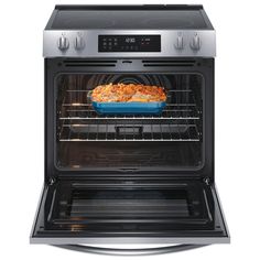 an open oven with food cooking in it