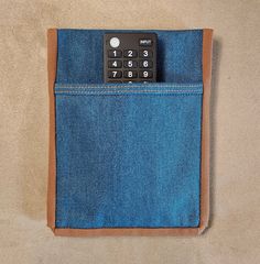 a calculator in the back pocket of a pair of jeans