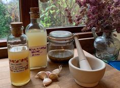 the ingredients for making homemade ginger syrup are displayed on a table next to a window