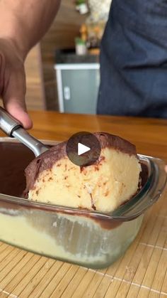 a person scooping some ice cream into a bowl