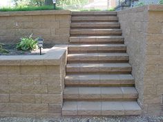 a stone wall with steps leading up to it