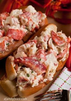 lobster salad in bread on a plate with a fork