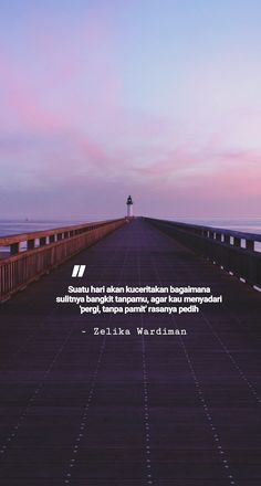 a long pier with a lighthouse in the distance and a quote on it that says,