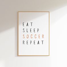 a framed poster with the words eat sleep soccer repeat