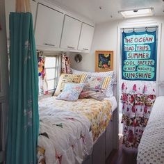 a bed sitting inside of a bedroom next to a window