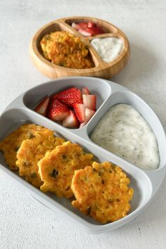 two plates with food in them and some fruit on the plate next to each other