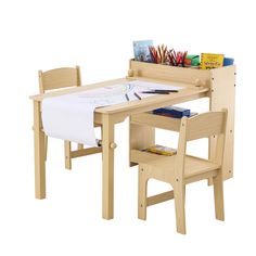 a child's table and chair set with books, pencils, and crayons