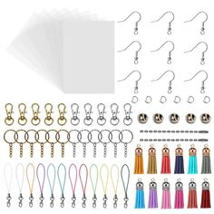 a bunch of different colored tassels and hooks on a white background with clippings