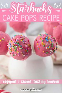 pink cake pops with sprinkles on top in a white cup and text overlay