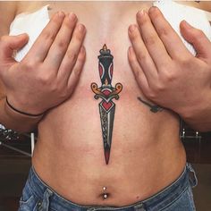 Sternum Traditional Tattoo, Traditional Tattoo Sternum, Sternum Tattoo Dagger, Dagger In Heart Tattoo, Dagger Sternum Tattoo Women, Sternum Tattoo American Traditional, Dagger Tattoo Sternum, Trad Dagger Tattoo, Underboob Tattoo Traditional