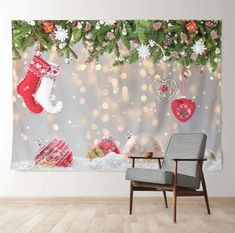 a christmas scene with stockings and ornaments hanging on the wall next to a rocking chair