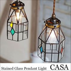 two stained glass pendant lights hanging from a ceiling fixture with the words, stained glass pendant light casca