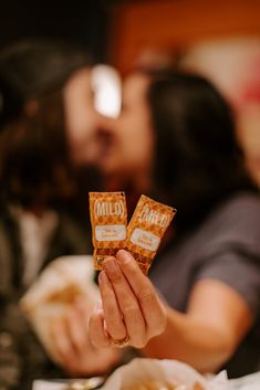 a person holding up some kind of snack