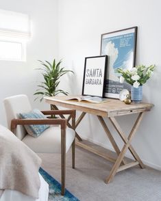 a bedroom with a desk and chair in it