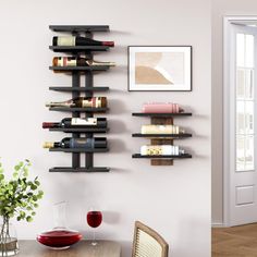 there is a wine rack on the wall next to a dining room table and chairs