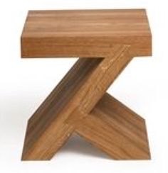 a small wooden stool sitting on top of a white floor