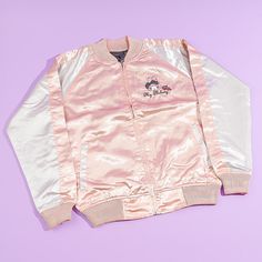 This super cute jacket is inspired by the iconic “sukajan” or the Japanese baseball varsity jacket that’s known for its large back design! Wear this shiny pink and white bomber jacket to keep you warm when it’s rainy! It has long sleeves, a small My Melody embroidery at the front, and a bigger version at the back! Made from 100% satin-like polyester Comes with a zipper closure and side pockets Width: 58 cm Length: 67 cm Sleeve length: 85 cm My Melody Jacket, Pink Harajuku Style Cotton Hoodie, Pink Space Jacket, Sanrio Jacket, Pink Cotton Kawaii Outerwear, Sukajan Jacket, Baseball Varsity Jacket, Cat Dresses, Cute Jackets