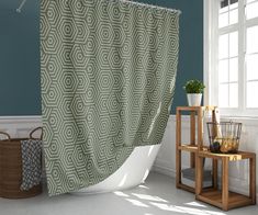 a bathroom scene with focus on the shower curtain and the bathtub in the foreground