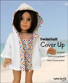 a doll wearing a white robe and colorful polka dot print on it's hood