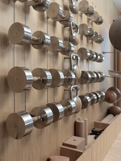 a wall mounted with many different types of knobs on it's sides and metal handles